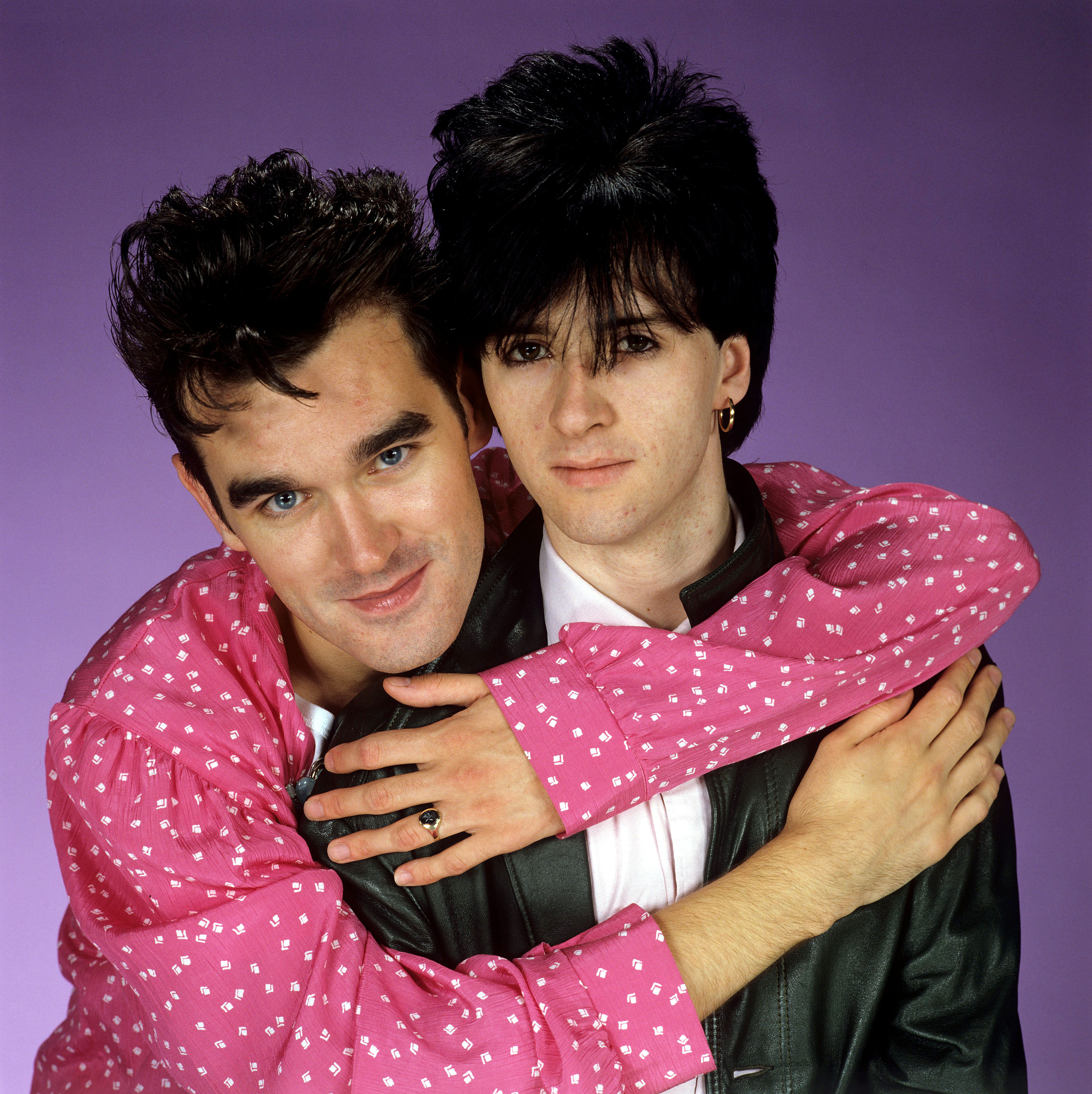 Morrissey and Johnny Marr of The Smiths in an embrace.